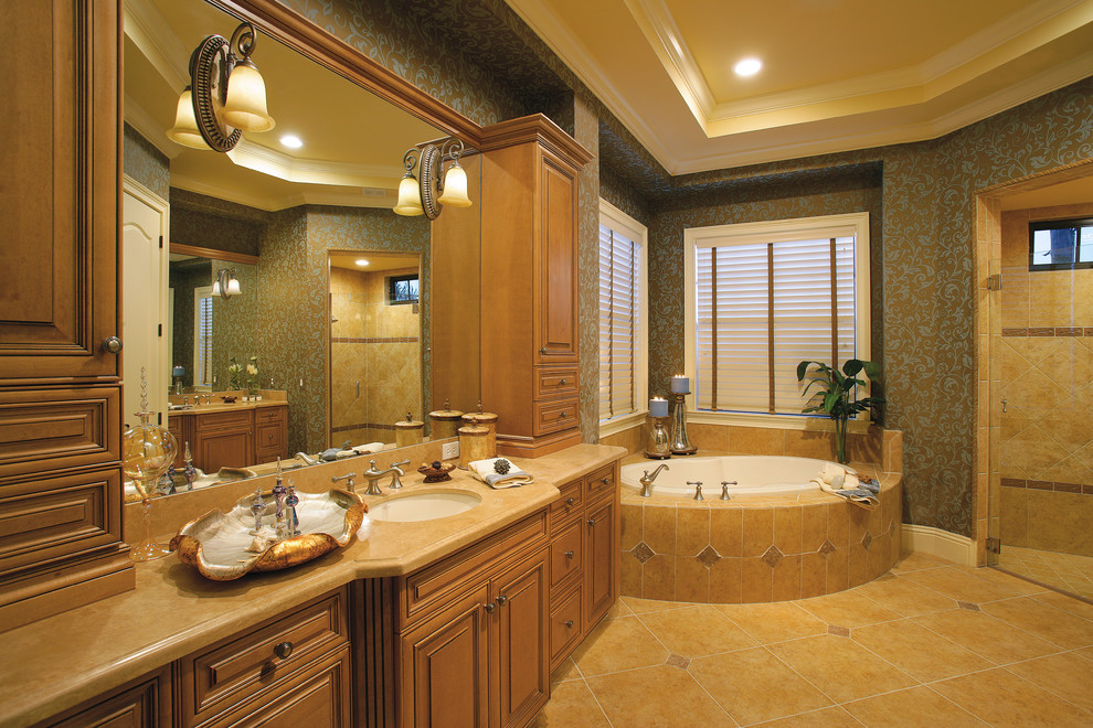 Photo of a large rural ensuite bathroom in Miami with a submerged sink, raised-panel cabinets, medium wood cabinets, marble worktops, a built-in bath, a corner shower, beige tiles, ceramic tiles, blue walls and ceramic flooring.