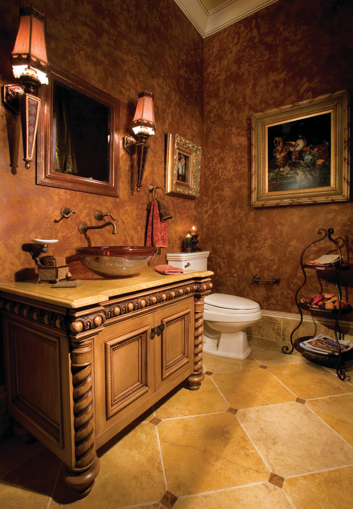 Bathroom - huge mediterranean master beige tile and stone tile travertine floor bathroom idea in Miami with a vessel sink, recessed-panel cabinets, medium tone wood cabinets, granite countertops, a two-piece toilet and multicolored walls