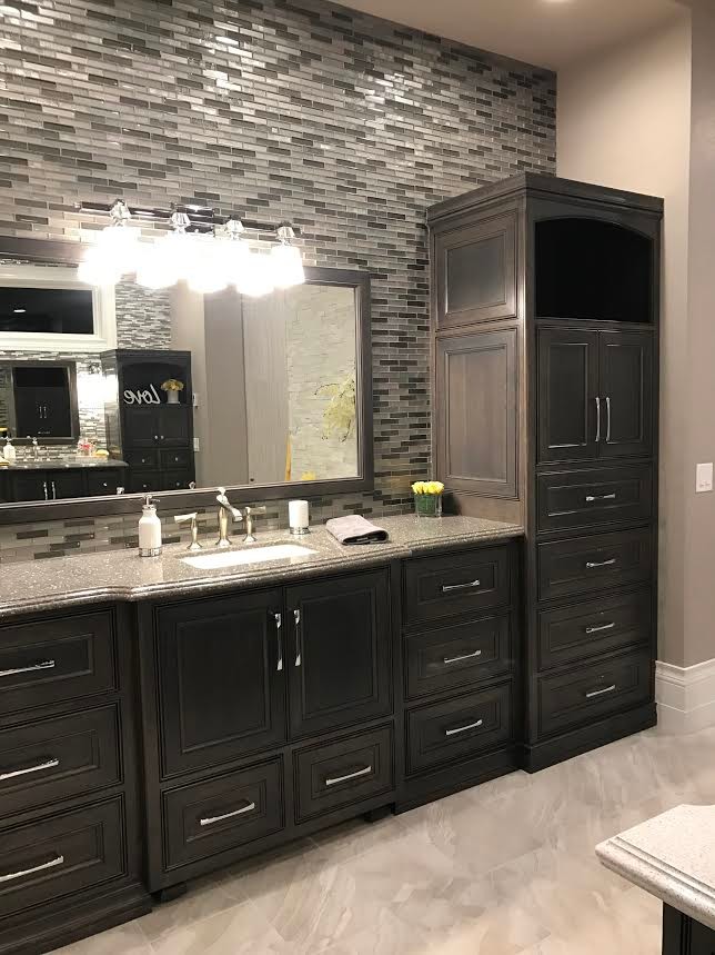 Photo of a large traditional ensuite bathroom in Minneapolis with grey walls, ceramic flooring, a submerged sink, a walk-in shower, recessed-panel cabinets, dark wood cabinets, a submerged bath and granite worktops.