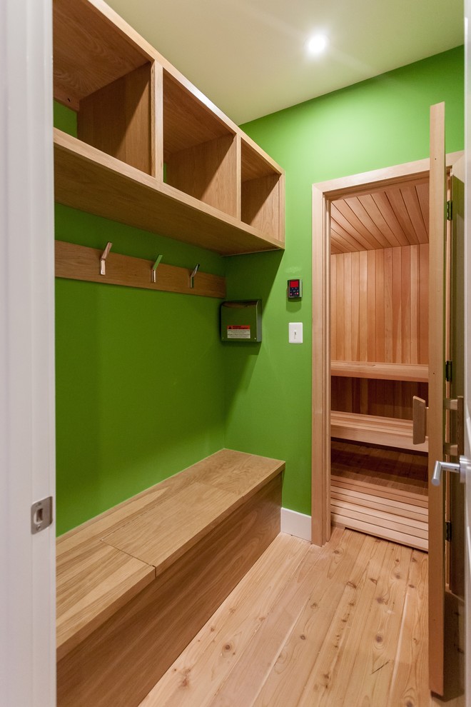 Design ideas for a contemporary sauna bathroom in DC Metro with light wood cabinets and beige floors.