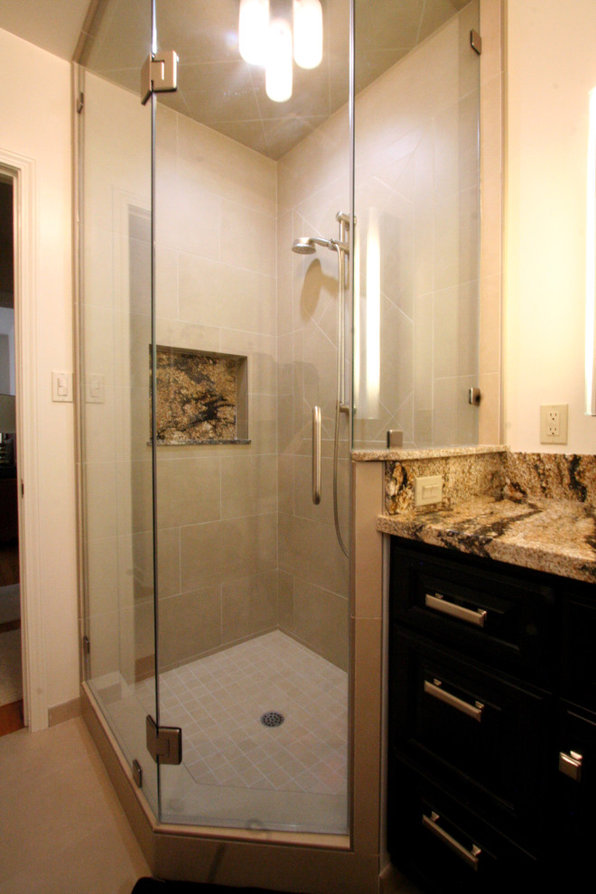 Photo of a medium sized classic ensuite bathroom in Other with a submerged sink, recessed-panel cabinets, dark wood cabinets, granite worktops, a corner shower, a two-piece toilet, beige tiles, porcelain tiles, beige walls and porcelain flooring.