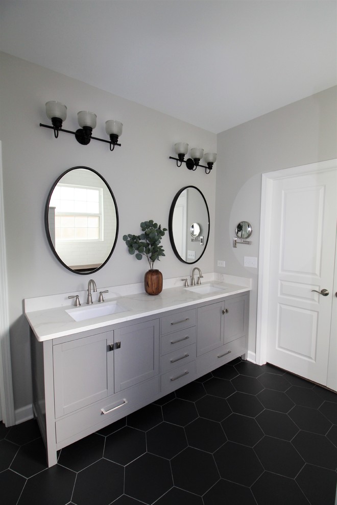 Mid-sized danish master white tile and subway tile dark wood floor and brown floor bathroom photo in Nashville with shaker cabinets, gray cabinets, a one-piece toilet, white countertops, gray walls, an undermount sink and quartzite countertops