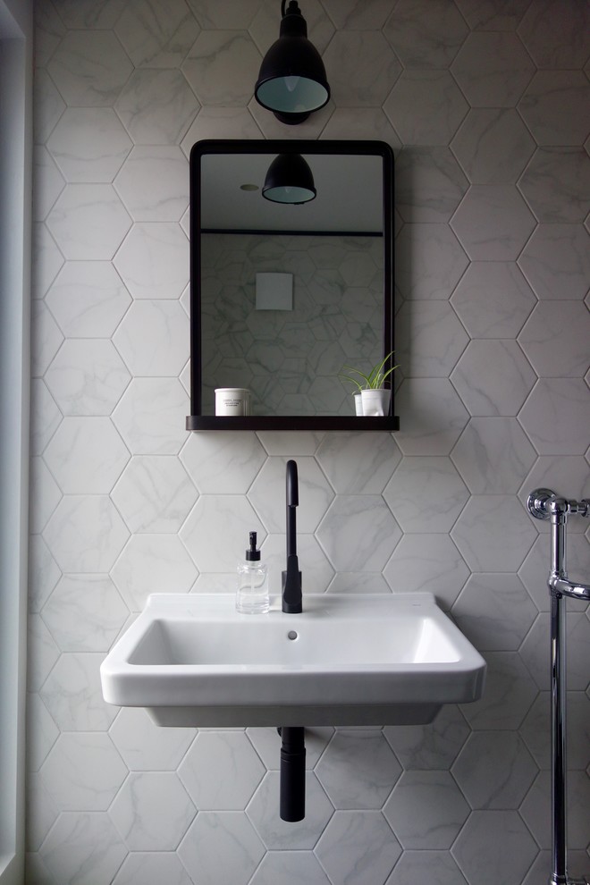 This is an example of a small scandi shower room bathroom in Other with a walk-in shower, a two-piece toilet, black and white tiles, porcelain tiles, white walls, porcelain flooring and a wall-mounted sink.