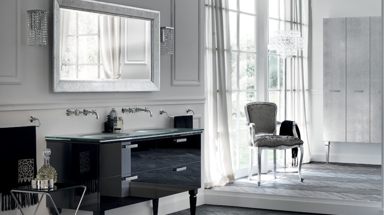 Photo of a contemporary ensuite bathroom in Montreal with flat-panel cabinets, black cabinets, a submerged sink, white walls, glass worktops, a freestanding bath and dark hardwood flooring.