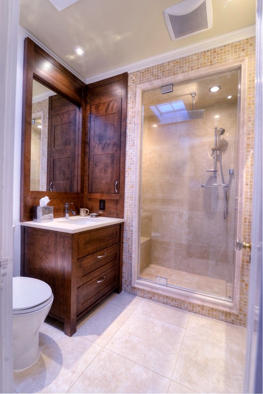 Inspiration for a medium sized classic bathroom in Montreal with recessed-panel cabinets, dark wood cabinets, an alcove shower, a two-piece toilet, beige tiles, ceramic tiles, beige walls, ceramic flooring, a submerged sink and engineered stone worktops.