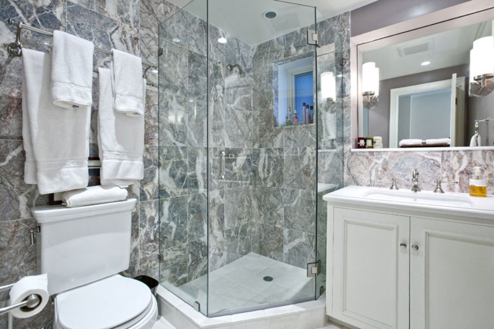 Example of a small classic 3/4 white tile and stone slab ceramic tile corner shower design in San Francisco with a console sink, recessed-panel cabinets, white cabinets, solid surface countertops, a one-piece toilet and white walls
