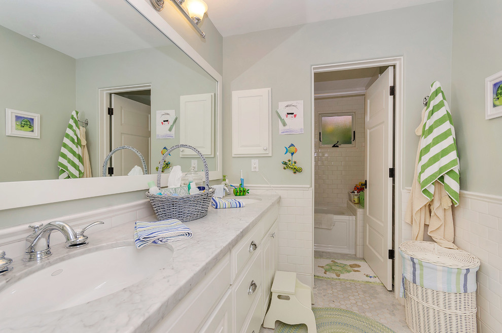 Inspiration for a mid-sized transitional kids' white tile and subway tile marble floor bathroom remodel in Phoenix with an undermount sink, shaker cabinets, white cabinets, marble countertops, a one-piece toilet and blue walls