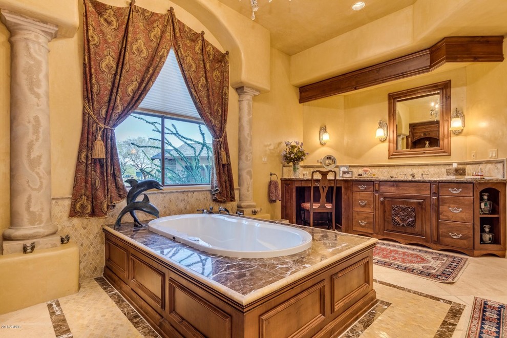 Example of a large tuscan master yellow tile bathroom design in Phoenix with granite countertops