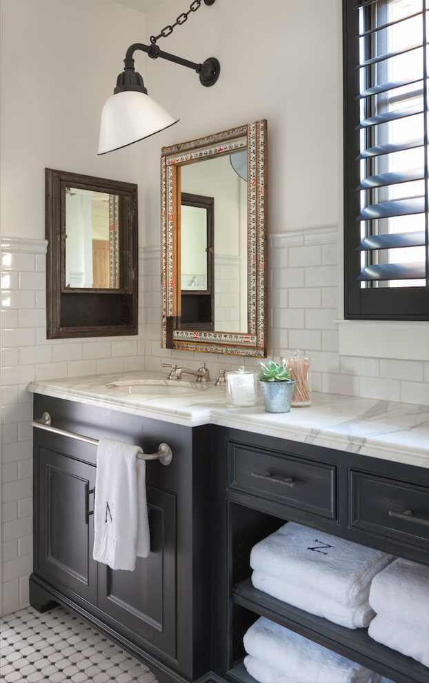 Inspiration for a large rural shower room bathroom in Phoenix with raised-panel cabinets, dark wood cabinets, white tiles, white walls and an integrated sink.