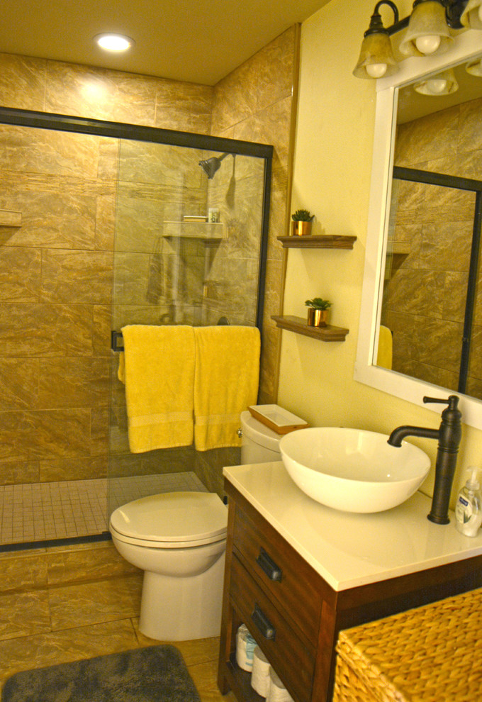 Small rustic ensuite bathroom in Hawaii with freestanding cabinets, dark wood cabinets, an alcove shower, a two-piece toilet, beige tiles, porcelain tiles, yellow walls, porcelain flooring, a vessel sink and engineered stone worktops.