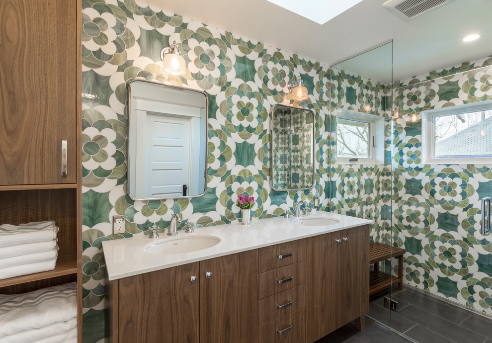 Transitional 3/4 green tile and multicolored tile black floor walk-in shower photo in Portland with flat-panel cabinets, dark wood cabinets, an undermount sink, a hinged shower door and white countertops