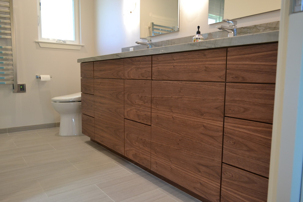 Photo of a medium sized traditional shower room bathroom in San Francisco with flat-panel cabinets, medium wood cabinets, a double shower, blue tiles, glass tiles, concrete flooring, a submerged sink, granite worktops, green floors, a hinged door and multi-coloured worktops.