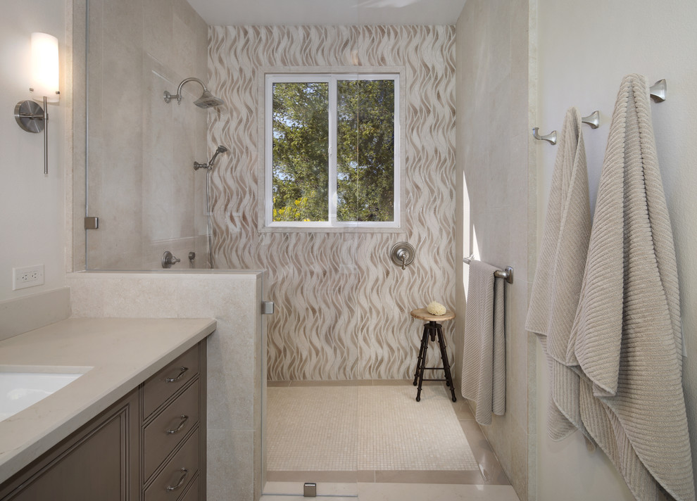 Inspiration for a medium sized traditional ensuite bathroom in Orange County with beige walls, beige floors, beaded cabinets, beige cabinets, a corner shower, beige tiles, porcelain tiles, porcelain flooring, a submerged sink, engineered stone worktops, an open shower and a freestanding bath.