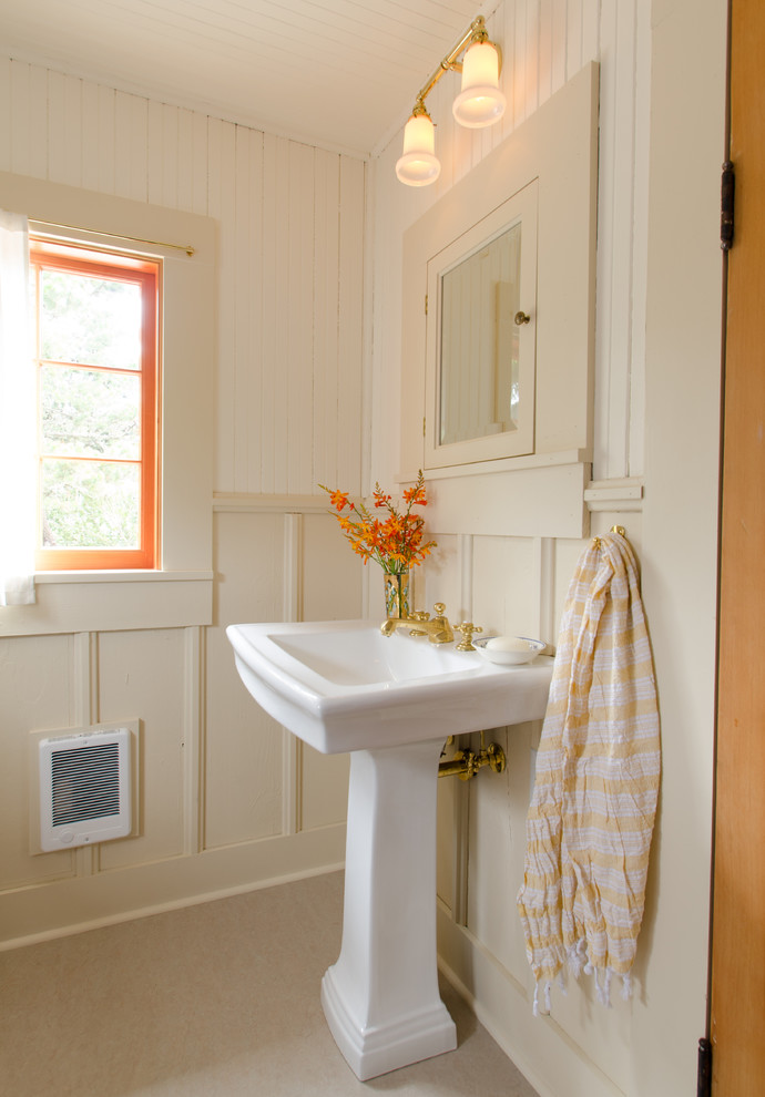 Inspiration for a coastal bathroom remodel in Portland with a pedestal sink