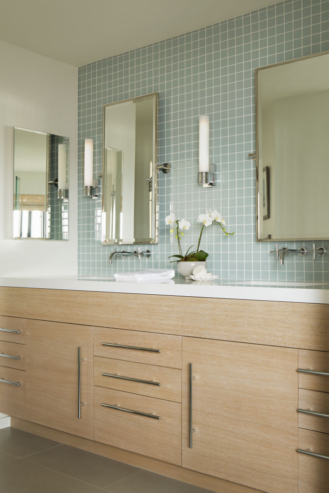 Example of a large beach style 3/4 blue tile porcelain tile, gray floor and double-sink bathroom design in Los Angeles with flat-panel cabinets, light wood cabinets, white walls, an undermount sink, white countertops and a built-in vanity