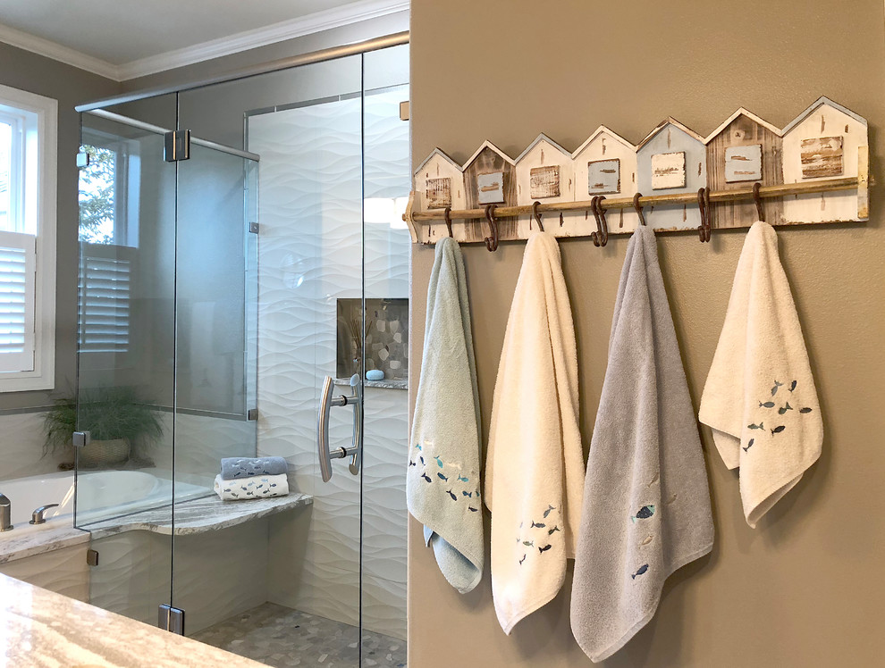 Mid-sized beach style master beige tile and porcelain tile porcelain tile and beige floor bathroom photo in Seattle with shaker cabinets, white cabinets, a two-piece toilet, an undermount sink, quartz countertops, a hinged shower door, black walls and black countertops