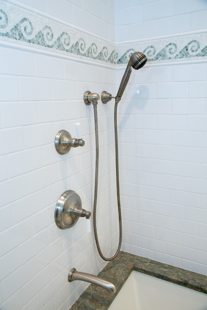 Example of a mid-sized beach style master white tile and subway tile bathroom design in Boston with granite countertops and an undermount tub