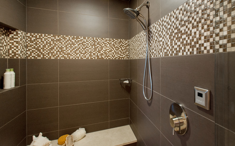 Medium sized contemporary ensuite bathroom in Seattle with flat-panel cabinets, white cabinets, a freestanding bath, a built-in shower, a two-piece toilet, porcelain tiles, white walls, marble flooring, a vessel sink, limestone worktops, beige floors, a hinged door, brown tiles and beige worktops.