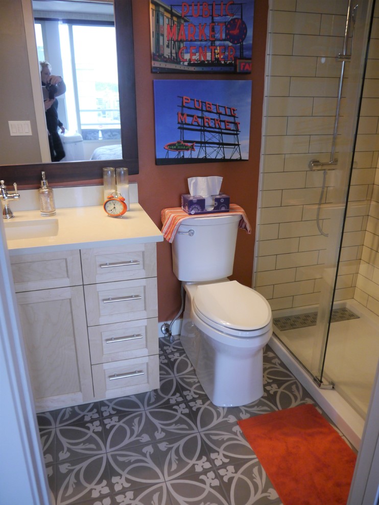 Example of a small transitional 3/4 white tile and ceramic tile cement tile floor and gray floor bathroom design in Seattle with shaker cabinets, light wood cabinets, a two-piece toilet, orange walls, an undermount sink, quartz countertops and white countertops