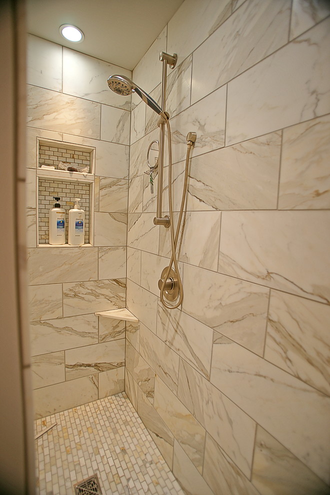 Large classic bathroom in Seattle with medium wood cabinets, an alcove bath, an alcove shower, white tiles, stone tiles, beige walls, marble flooring, a vessel sink and marble worktops.