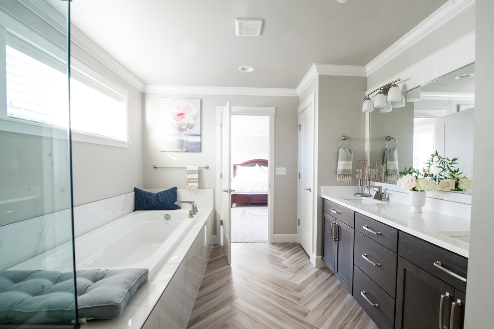 Large transitional master white tile ceramic tile and gray floor bathroom photo in Seattle with shaker cabinets, white cabinets, a one-piece toilet, gray walls, an undermount sink, quartz countertops and a hinged shower door