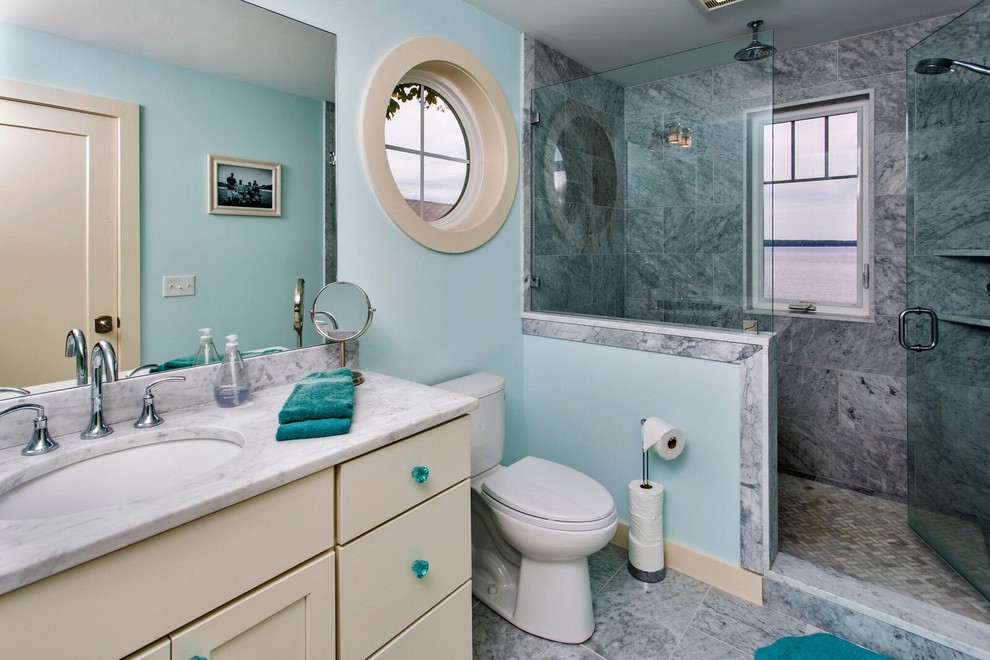 Inspiration for a small coastal 3/4 black and white tile, gray tile and stone tile marble floor alcove shower remodel in Portland Maine with shaker cabinets, white cabinets, a one-piece toilet, blue walls, an undermount sink and marble countertops