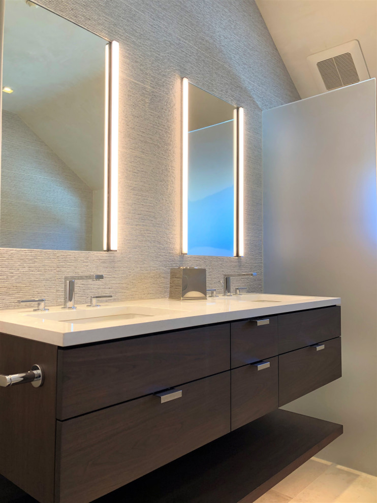 Example of a mid-sized trendy master gray tile beige floor, double-sink and vaulted ceiling bathroom design in Other with flat-panel cabinets, dark wood cabinets, gray walls, an undermount sink, white countertops and a floating vanity