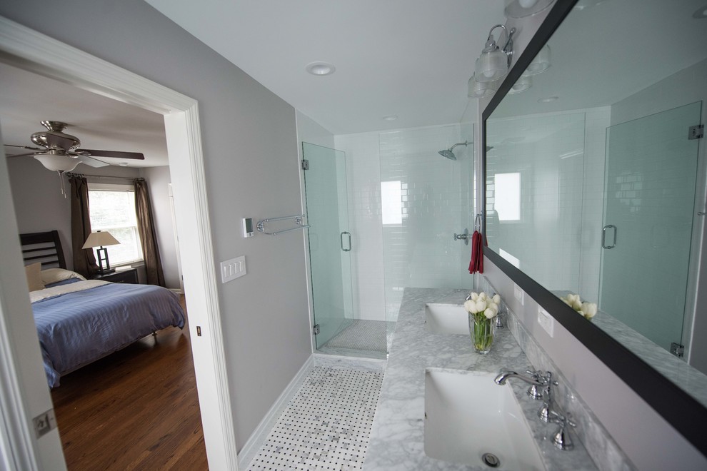 Walk-in shower - small contemporary 3/4 white tile and ceramic tile white floor and double-sink walk-in shower idea in Chicago with shaker cabinets, white cabinets, beige walls, a drop-in sink, marble countertops, a hinged shower door, white countertops and a freestanding vanity