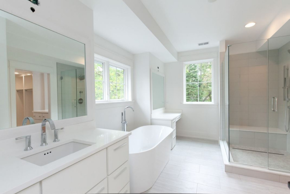 Inspiration for a large farmhouse master white tile and subway tile white floor and single-sink bathroom remodel in Chicago with raised-panel cabinets, white cabinets, white walls, an undermount sink, quartz countertops, a hinged shower door, white countertops and a freestanding vanity