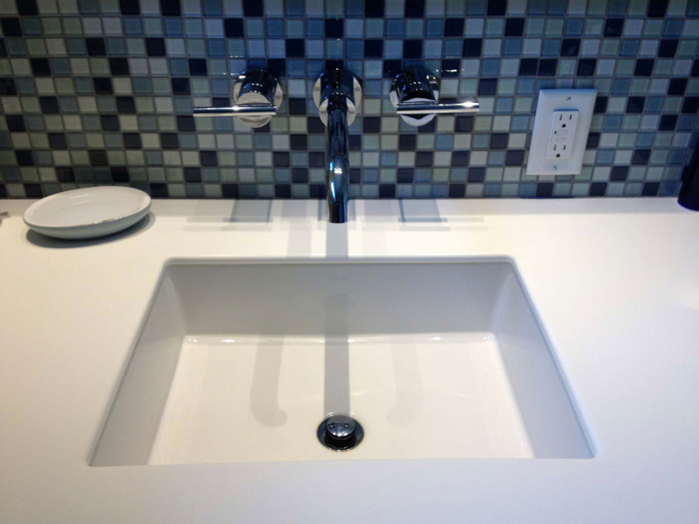 Example of a small transitional 3/4 blue tile and mosaic tile bathroom design in Other with blue walls, an undermount sink, quartzite countertops and a two-piece toilet