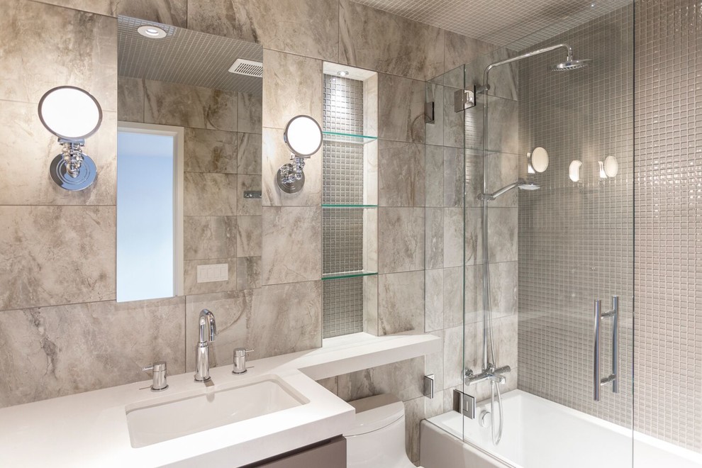 Bathroom - mid-sized modern 3/4 beige tile and porcelain tile bathroom idea in Salt Lake City with a one-piece toilet, beige walls, quartzite countertops, a hinged shower door, flat-panel cabinets, beige cabinets, an undermount sink and white countertops