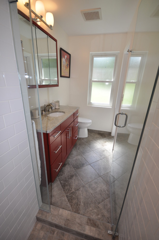 Medium sized classic ensuite bathroom in DC Metro with flat-panel cabinets, red cabinets, an alcove shower, white tiles, metro tiles, white walls, ceramic flooring, a submerged sink and granite worktops.