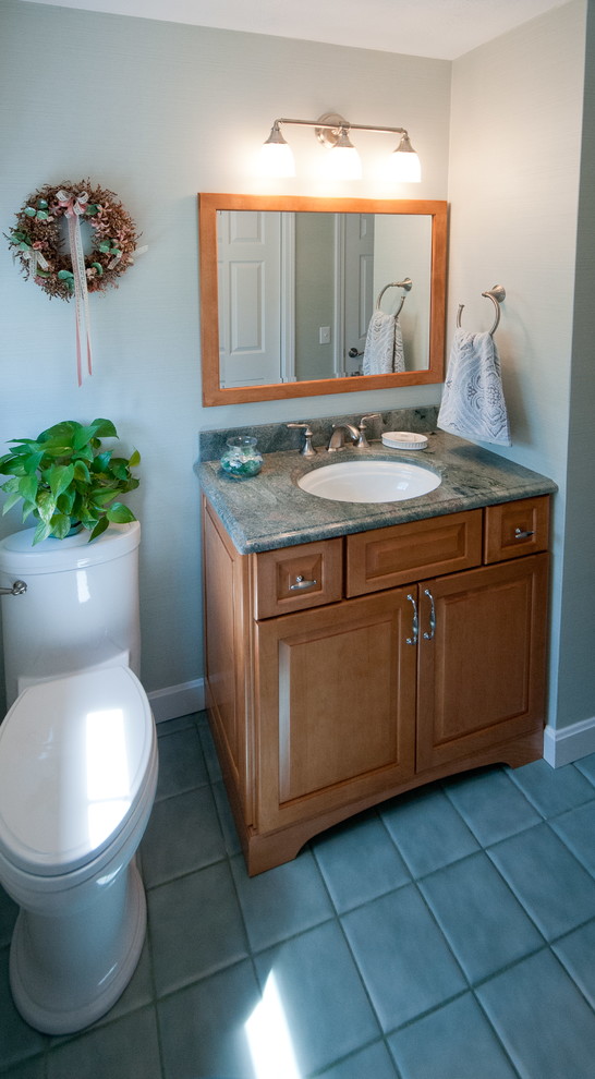 Inspiration for a small timeless green tile and ceramic tile ceramic tile bathroom remodel in Providence with raised-panel cabinets, light wood cabinets, granite countertops, a two-piece toilet, an undermount sink and green walls