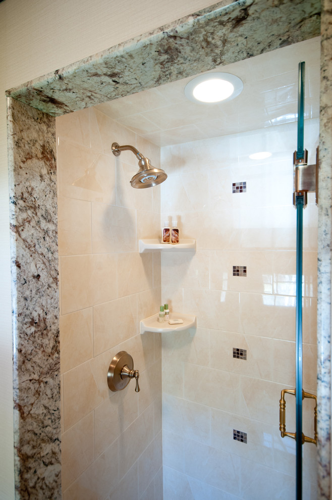 Inspiration for a medium sized classic ensuite bathroom in Providence with freestanding cabinets, medium wood cabinets, granite worktops, beige tiles, ceramic tiles, an alcove shower, a two-piece toilet, a submerged sink, beige walls and porcelain flooring.