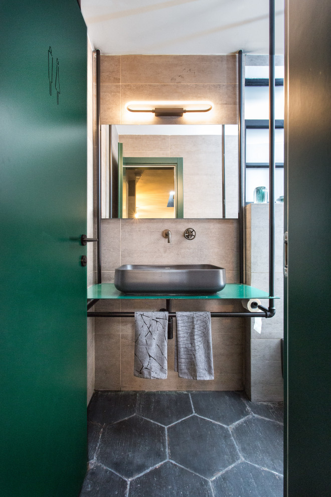 Small industrial shower room bathroom in Tel Aviv with grey tiles, porcelain tiles, porcelain flooring, stainless steel worktops, green worktops, a vessel sink and grey floors.