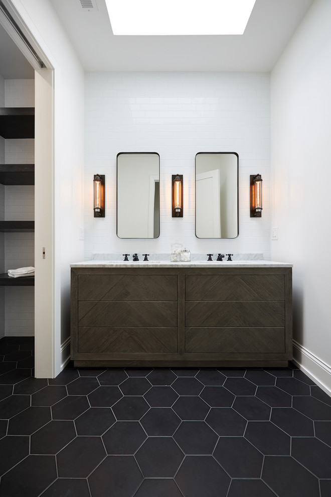 Photo of a classic family bathroom in Chicago with flat-panel cabinets, brown cabinets, white tiles, metro tiles, white walls, ceramic flooring, a built-in sink, marble worktops, black floors and grey worktops.