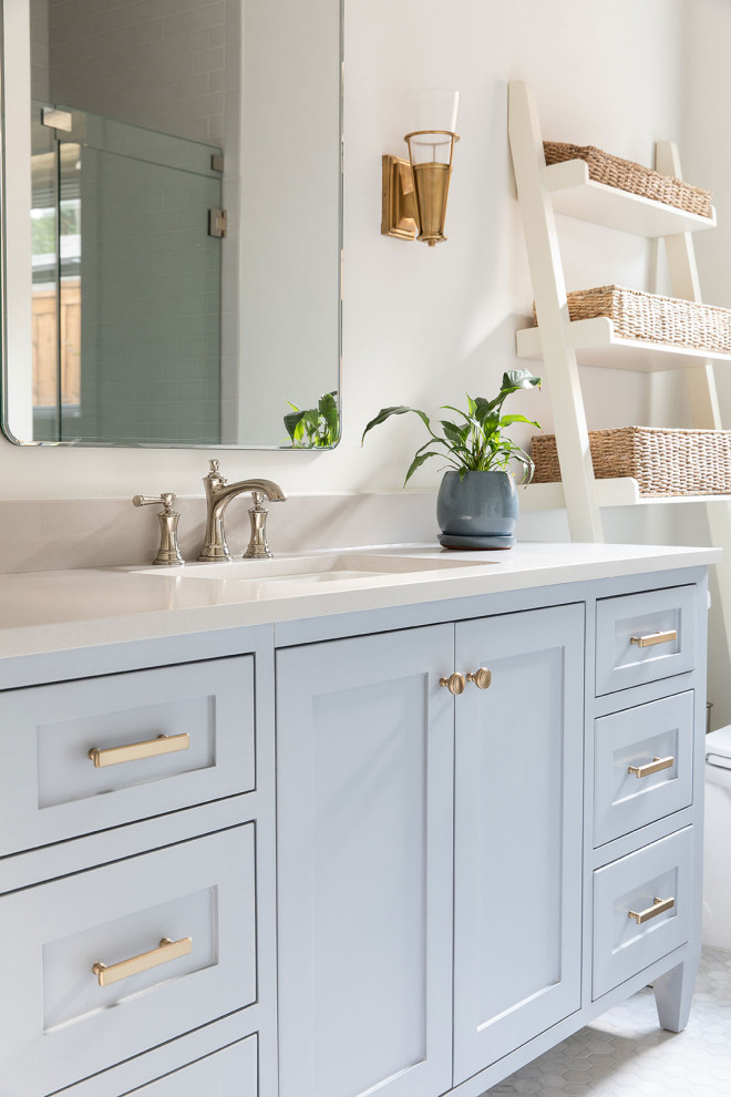 Inspiration for a transitional mosaic tile floor, gray floor and single-sink bathroom remodel in Dallas with shaker cabinets, blue cabinets, white walls, an undermount sink, white countertops and a freestanding vanity