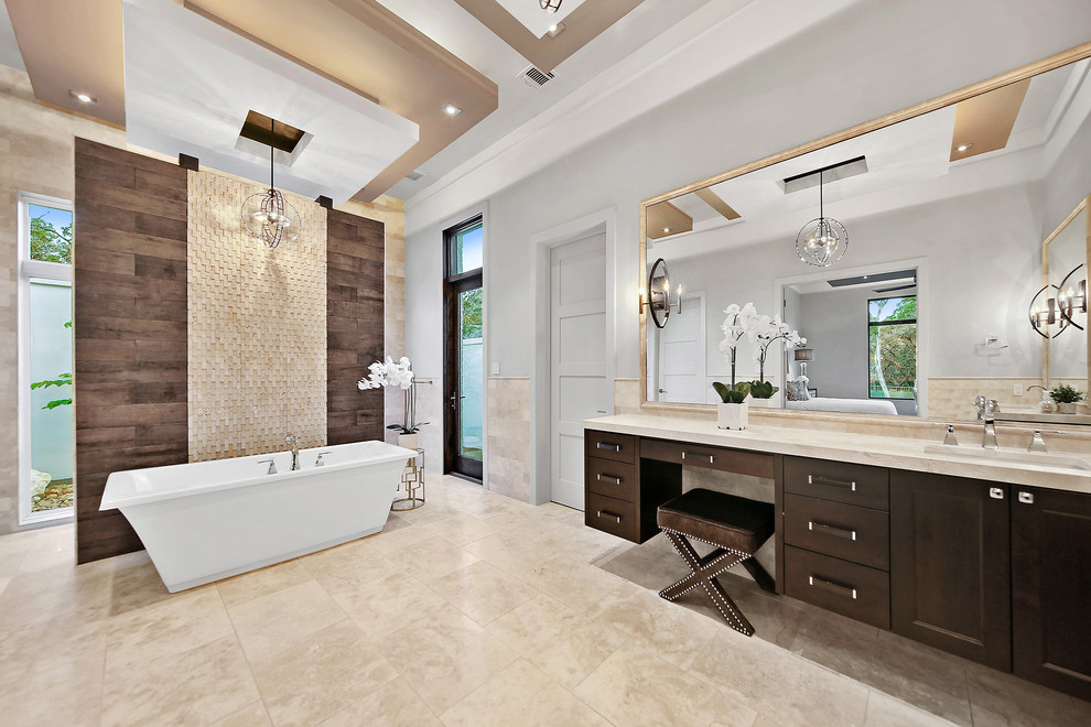 Example of a large transitional master white tile and porcelain tile marble floor and beige floor bathroom design in Austin with flat-panel cabinets, beige cabinets, a one-piece toilet, white walls, a drop-in sink and marble countertops