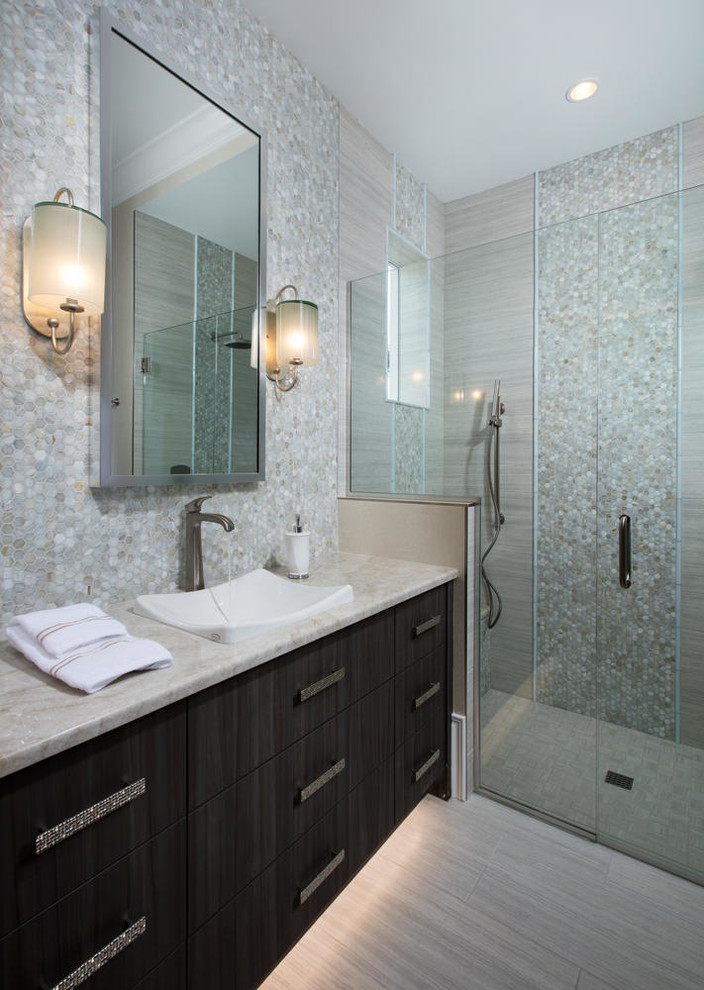 Photo of a large classic shower room bathroom in Miami with flat-panel cabinets, brown cabinets, a corner shower, a two-piece toilet, multi-coloured tiles, stone tiles, beige walls, light hardwood flooring, a submerged sink, granite worktops, beige floors and a hinged door.