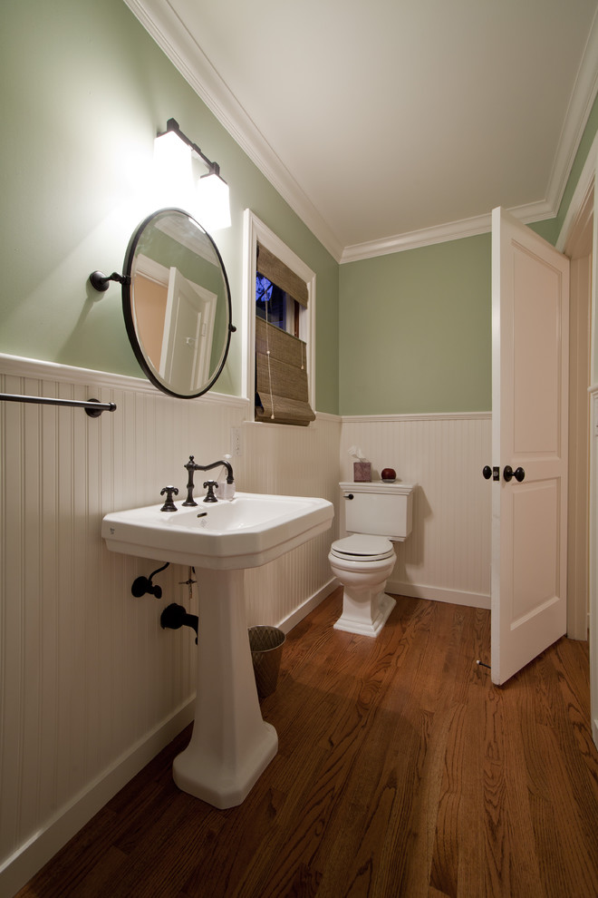 Example of a classic bathroom design in San Francisco with a pedestal sink and green walls