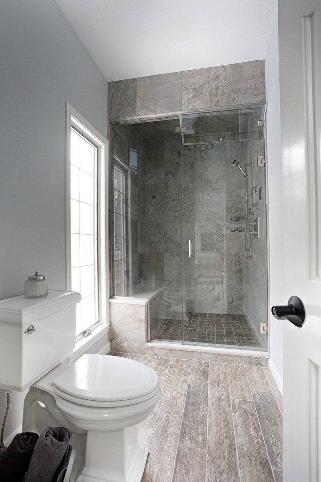 This is an example of a large contemporary ensuite bathroom in Bridgeport with a submerged sink, dark wood cabinets, a freestanding bath, grey walls, multi-coloured tiles, an alcove shower, ceramic tiles and porcelain flooring.
