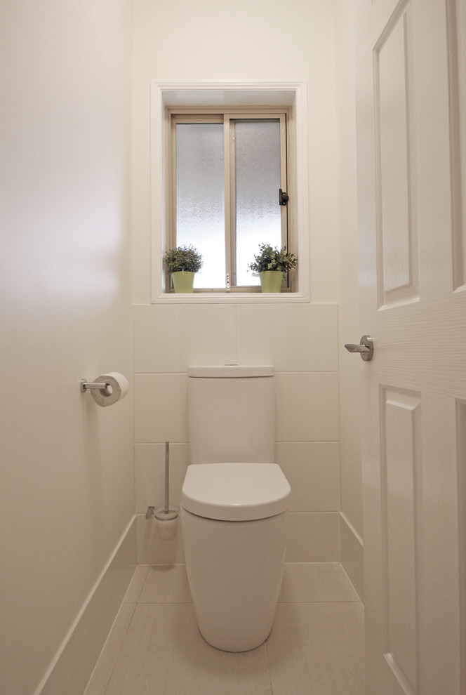 Inspiration for a small contemporary cloakroom in Brisbane with flat-panel cabinets, green cabinets, a two-piece toilet, white tiles, mosaic tiles, white walls, porcelain flooring, a vessel sink, engineered stone worktops, beige floors and white worktops.