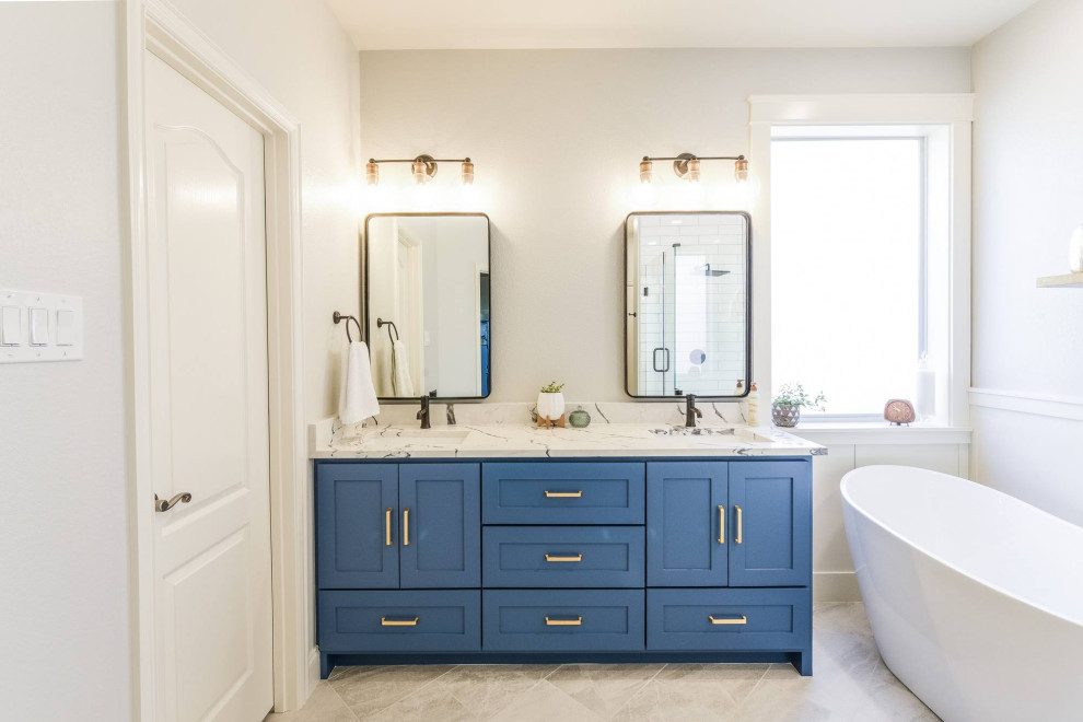 Example of a mid-sized transitional master white tile and ceramic tile porcelain tile, gray floor, double-sink and wall paneling bathroom design in Dallas with shaker cabinets, blue cabinets, gray walls, an undermount sink, quartz countertops, a hinged shower door, white countertops, a niche and a built-in vanity