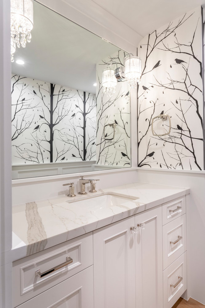 Inspiration for an expansive classic bathroom in Los Angeles with white cabinets, white walls, medium hardwood flooring, a submerged sink, engineered stone worktops, white worktops and recessed-panel cabinets.