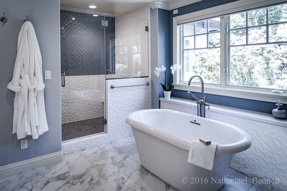 Photo of a large traditional ensuite bathroom in San Francisco with a freestanding bath, an alcove shower, blue tiles, glass tiles, blue walls, marble flooring, shaker cabinets, white cabinets, a two-piece toilet, an integrated sink and solid surface worktops.