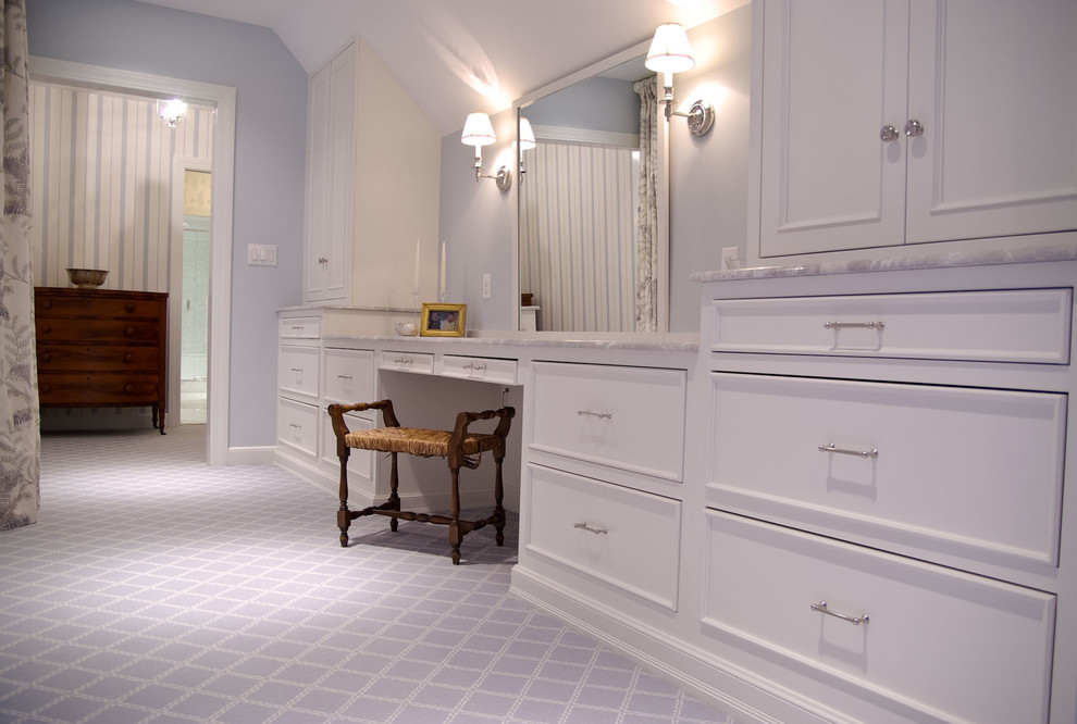 Traditional ensuite bathroom in Boston with flat-panel cabinets, white cabinets and marble worktops.
