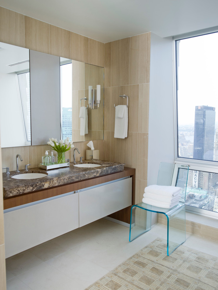 Immagine di una stanza da bagno padronale contemporanea con pavimento in gres porcellanato, ante lisce, ante bianche e lavabo sottopiano