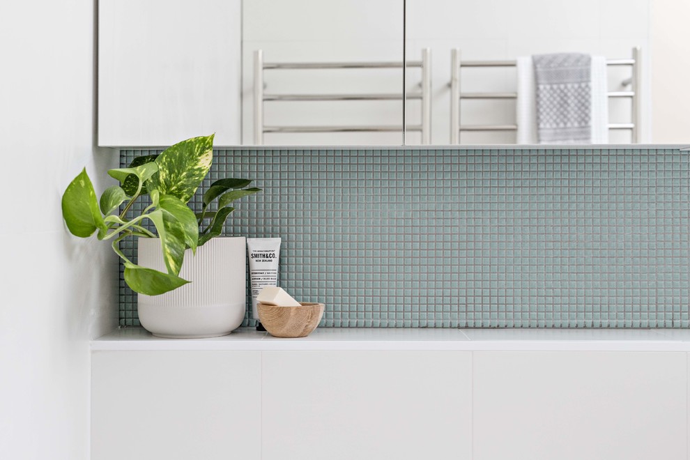 This is an example of a medium sized contemporary ensuite bathroom in Sydney with medium wood cabinets, a built-in bath, a corner shower, white tiles, ceramic tiles, white walls, porcelain flooring, a wall-mounted sink, grey floors and an open shower.