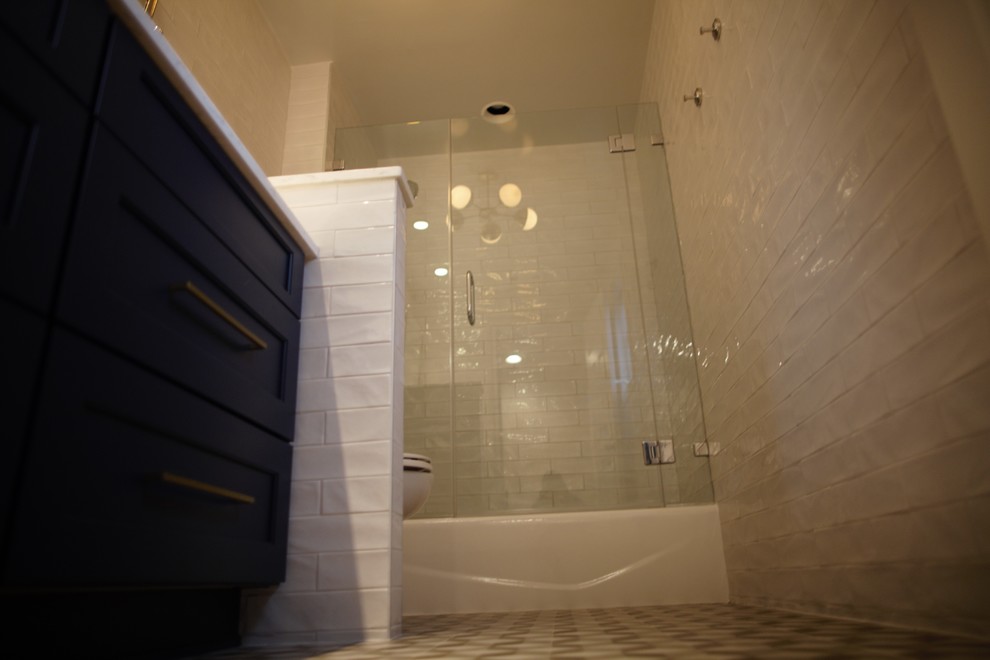 Inspiration for a small modern kids' white tile and porcelain tile ceramic tile bathroom remodel in DC Metro with recessed-panel cabinets, black cabinets, white walls and a hinged shower door