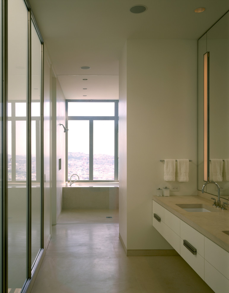 Example of a large minimalist master beige tile travertine floor bathroom design in San Francisco with an undermount sink, beaded inset cabinets, white cabinets and white walls